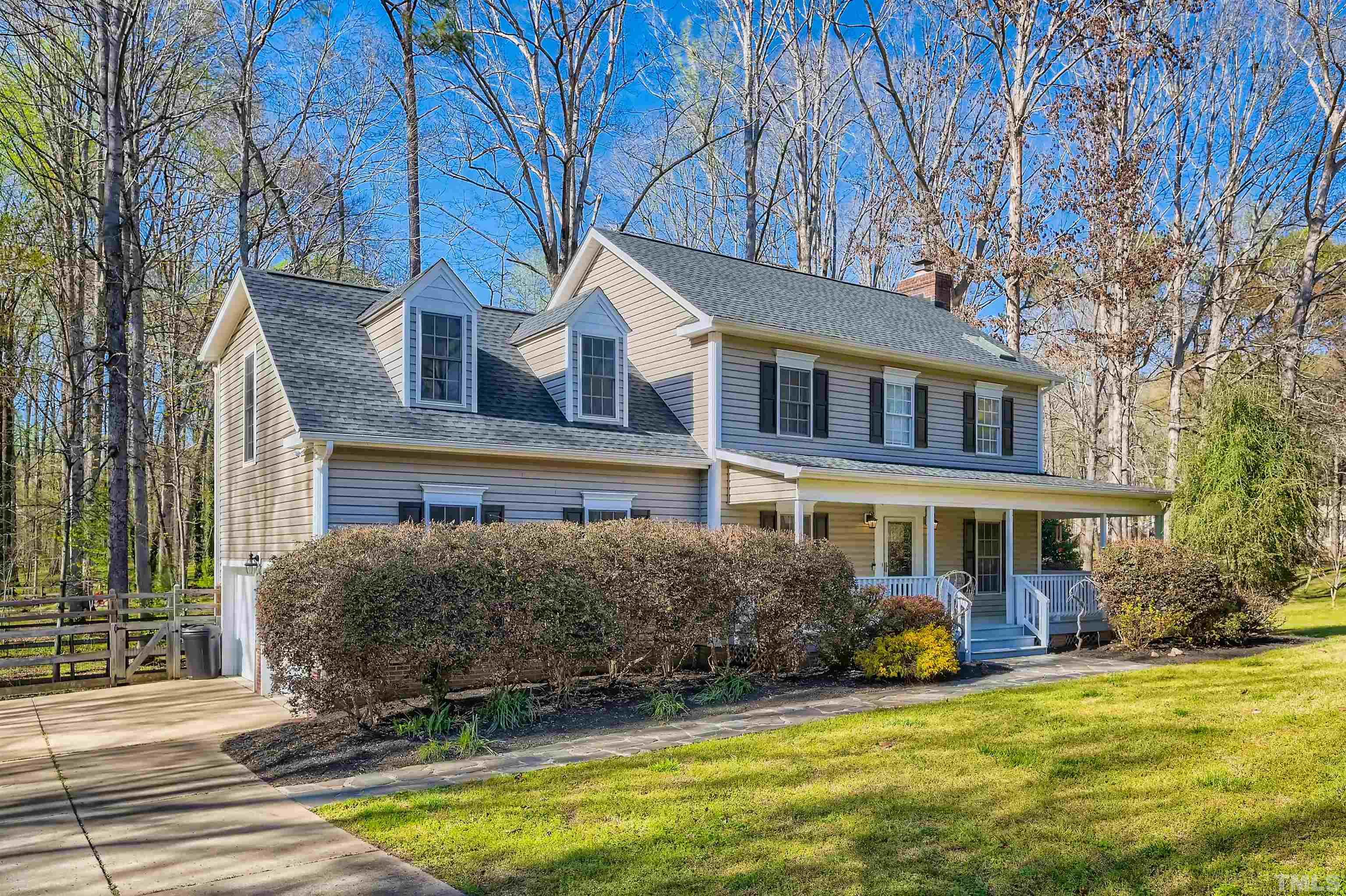 1705 Reynolda Court Raleigh, NC 27603 - Photo 3 of 28 a front view of a house with a yard table and chairs