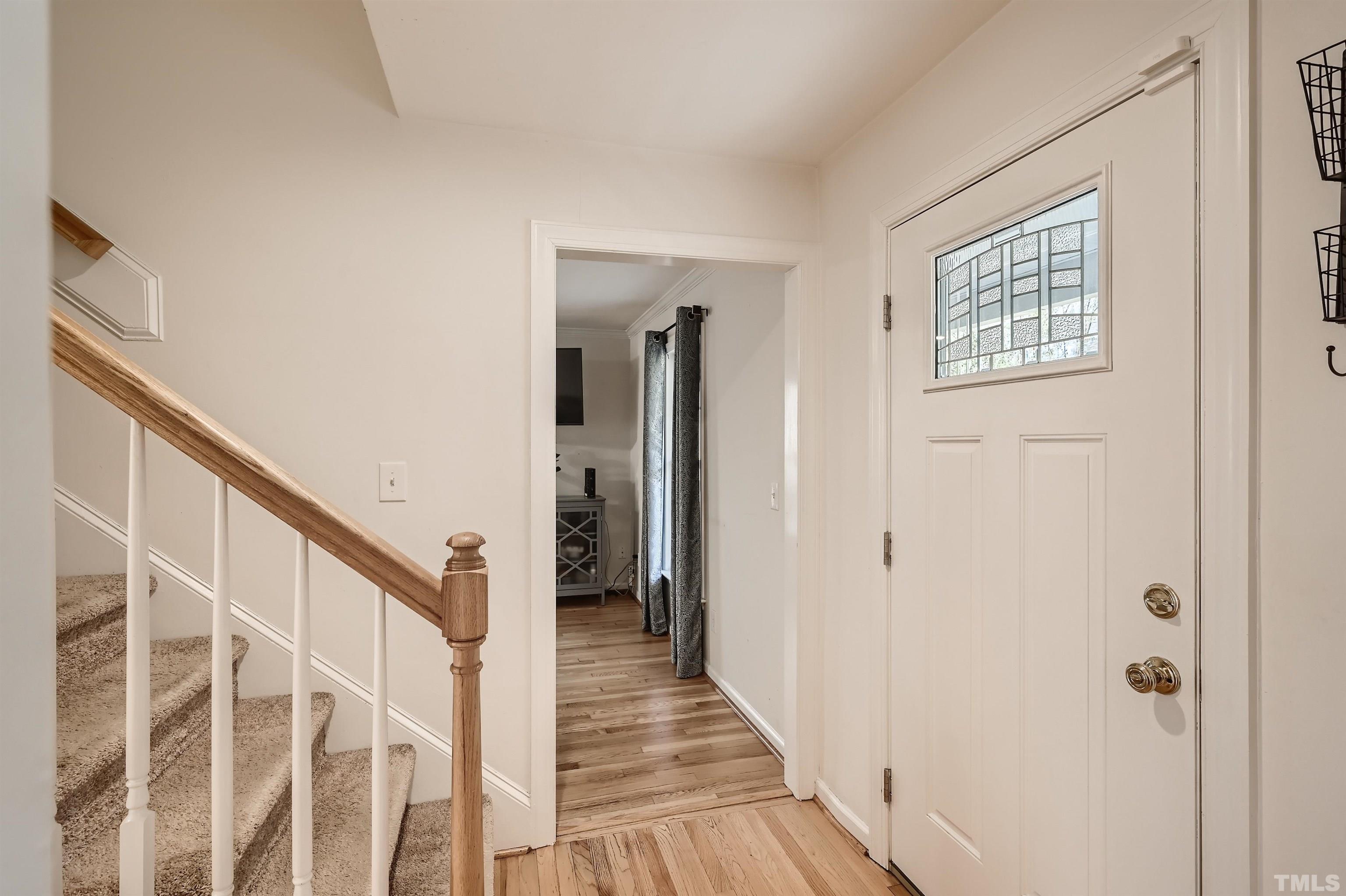 1705 Reynolda Court Raleigh, NC 27603 - Photo 5 of 28 a view of a hallway with wooden floor and entryway