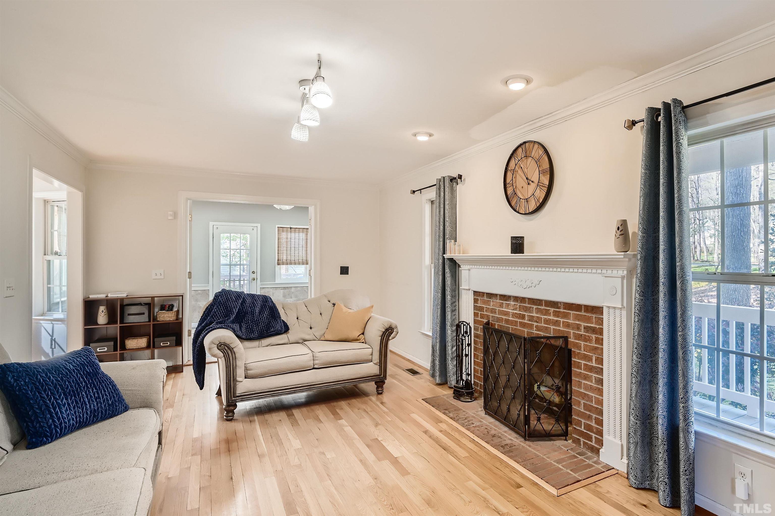 1705 Reynolda Court Raleigh, NC 27603 - Photo 6 of 28 a living room with furniture and a fireplace