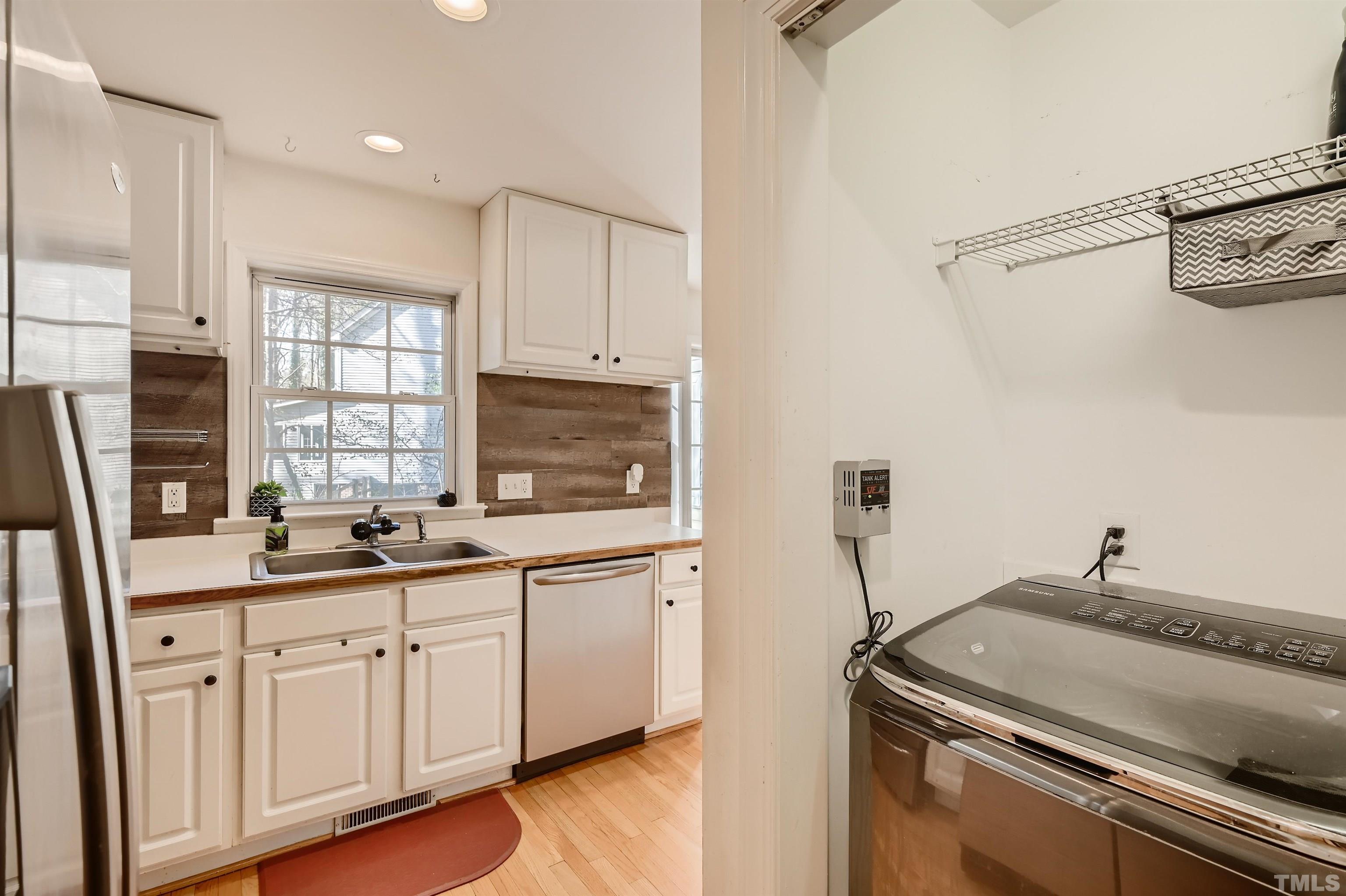 1705 Reynolda Court Raleigh, NC 27603 - Photo 10 of 28 a kitchen with a sink and cabinets