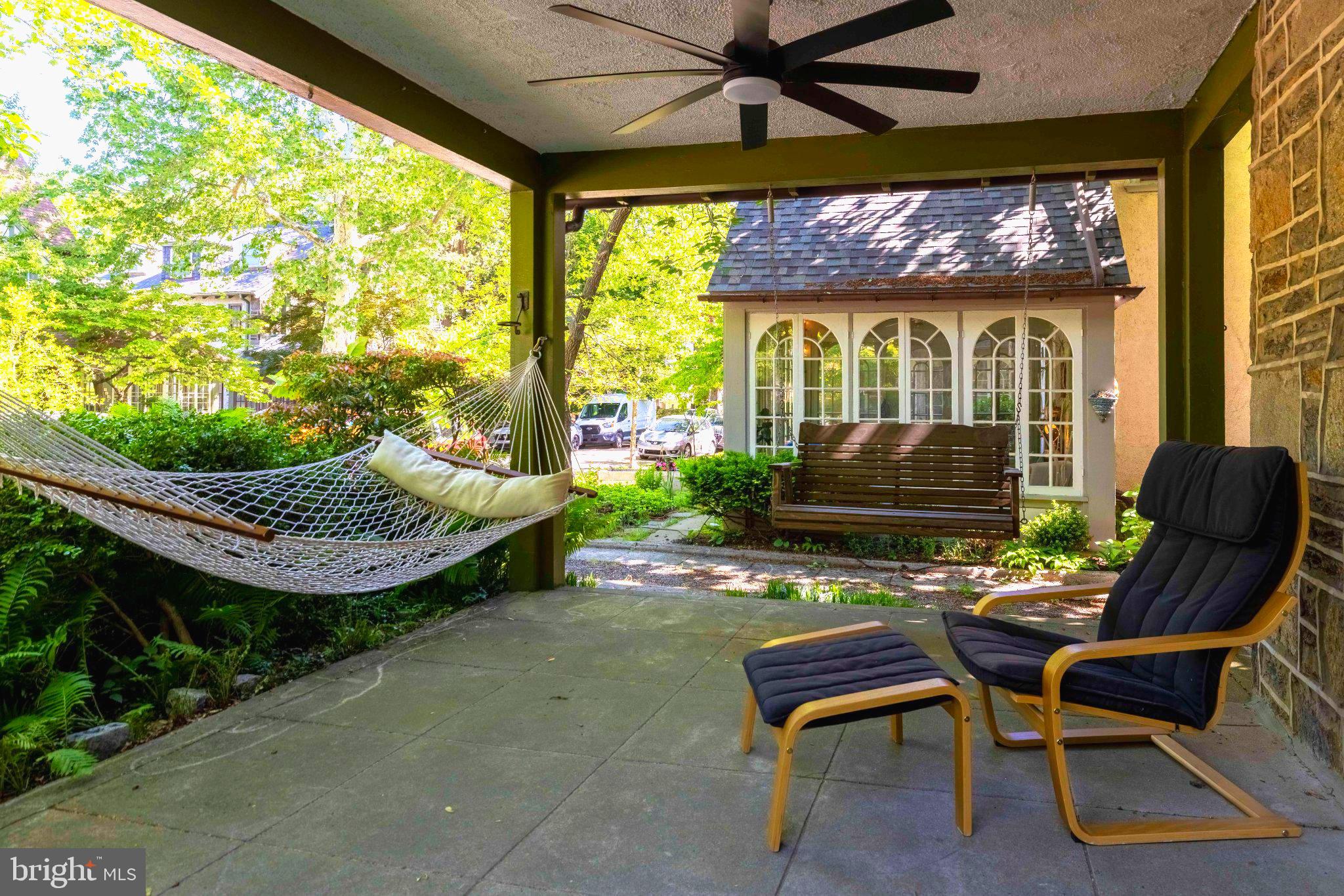 316 Wellesley Road Philadelphia, PA 19119 - Photo 3 of 29 Serene porch with lush greenery.