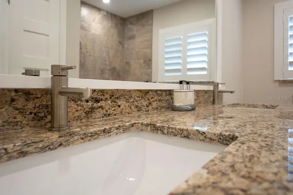 a view of a backyard with a patio