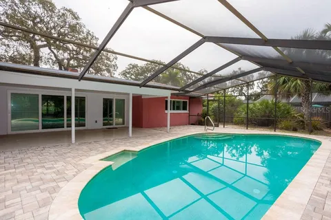 a view of a house with a yard and porch