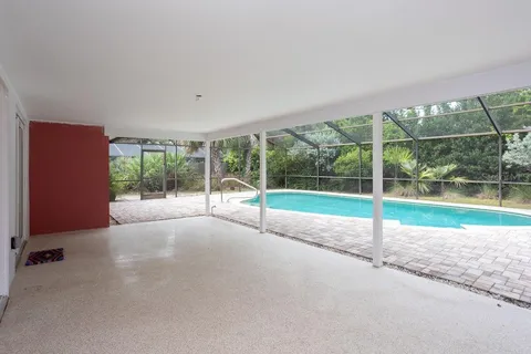 a view of a swimming pool with a patio