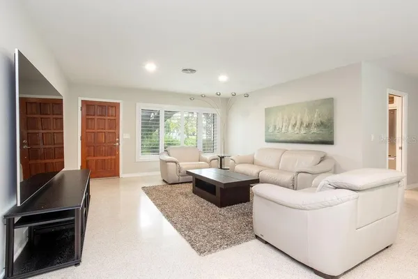 a living room with furniture and a window