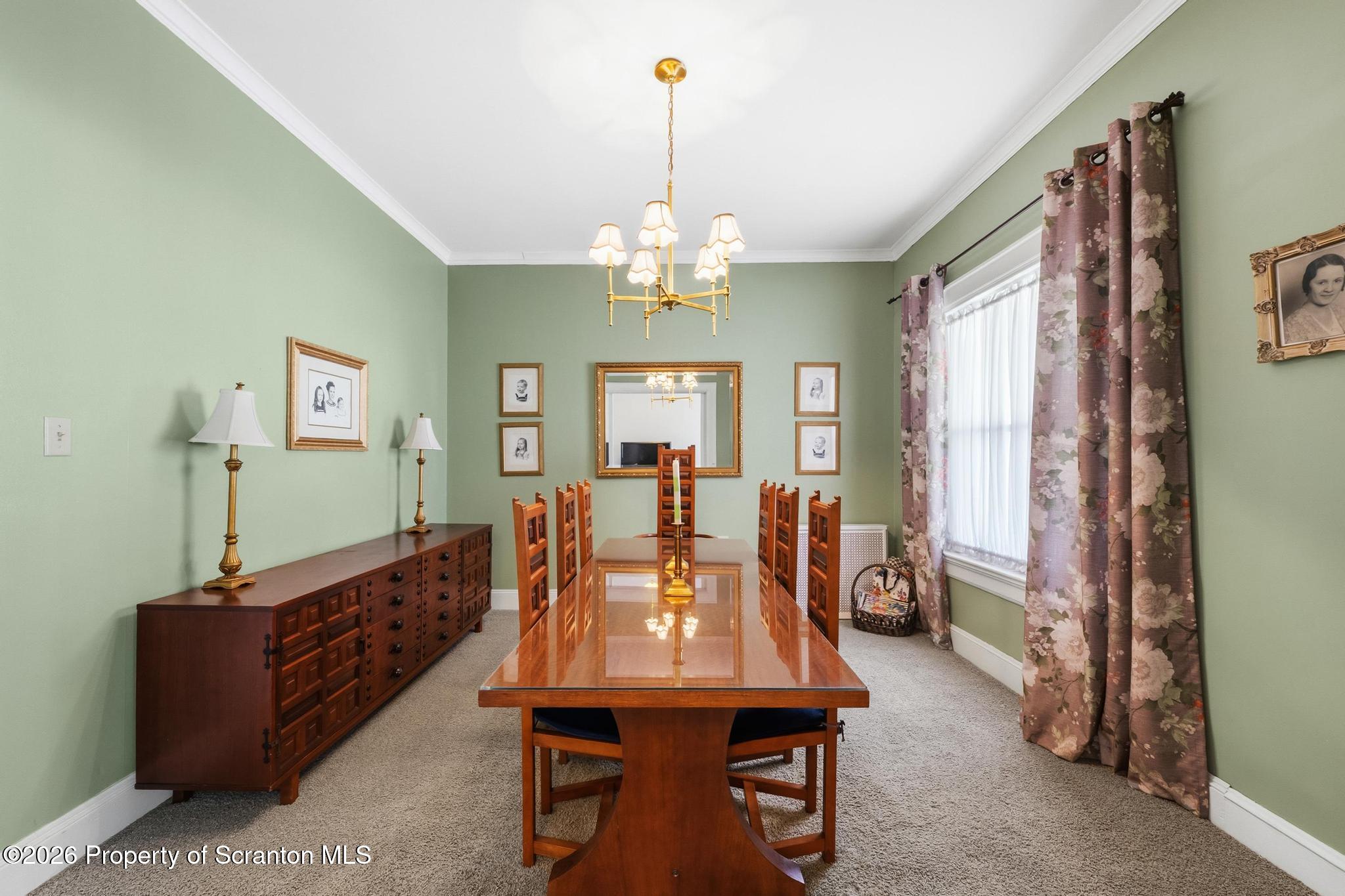 616 Myrtle Street Scranton, PA 18510 - Photo 11 of 65 a view of a dining room with furniture and a chandelier
