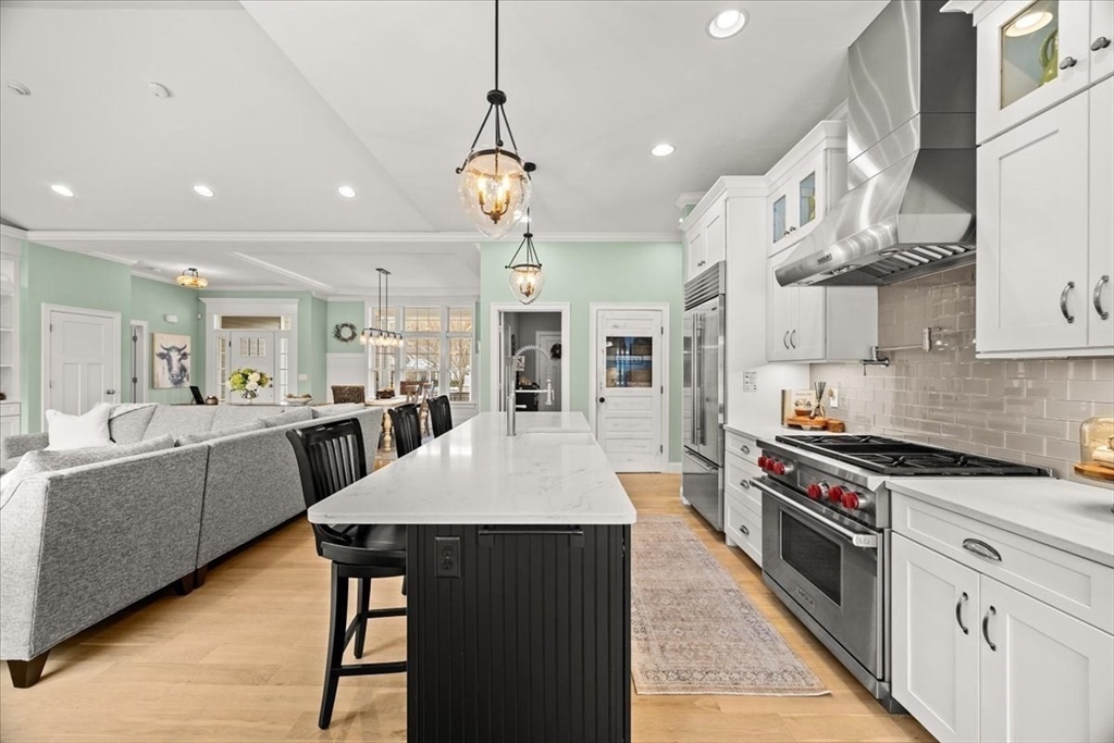 34 Palmer River Road Swansea, MA 02777 - Photo 15 of 42 a large white kitchen with lots of counter space a sink and stainless steel appliances