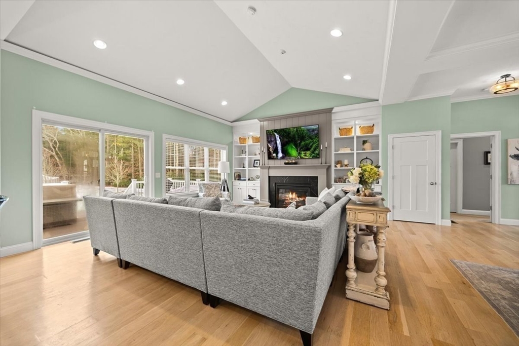 34 Palmer River Road Swansea, MA 02777 - Photo 24 of 42 a living room with furniture a flat screen tv and a fireplace