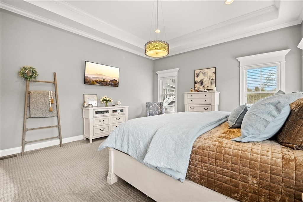 34 Palmer River Road Swansea, MA 02777 - Photo 30 of 42 a bedroom with a bed and a cabinets