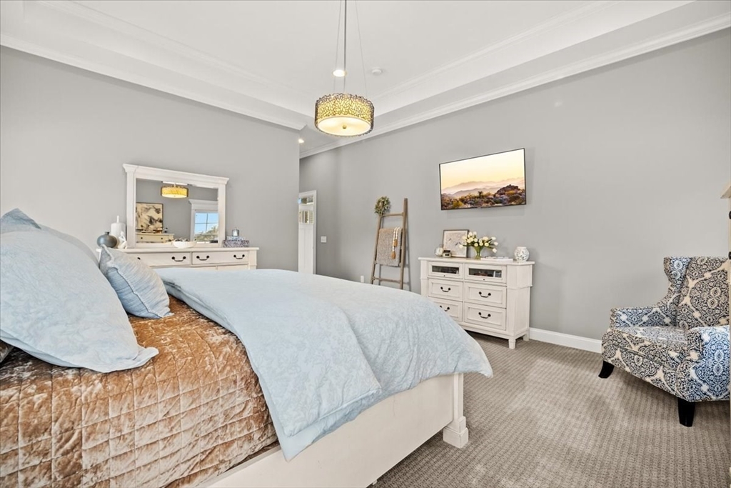 34 Palmer River Road Swansea, MA 02777 - Photo 31 of 42 a bedroom with a bed and a cabinets