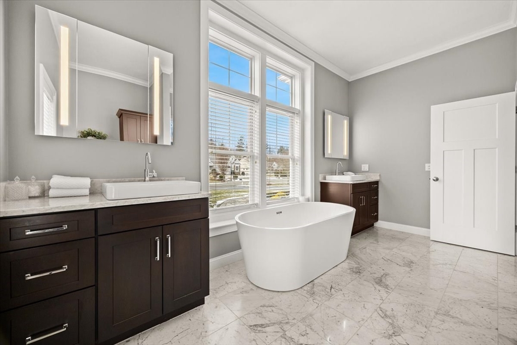 34 Palmer River Road Swansea, MA 02777 - Photo 33 of 42 a spacious bathroom with a tub sink and mirror
