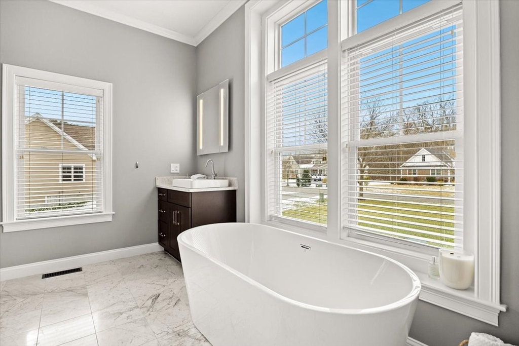 34 Palmer River Road Swansea, MA 02777 - Photo 35 of 42 a bathroom with a bathtub and a sink
