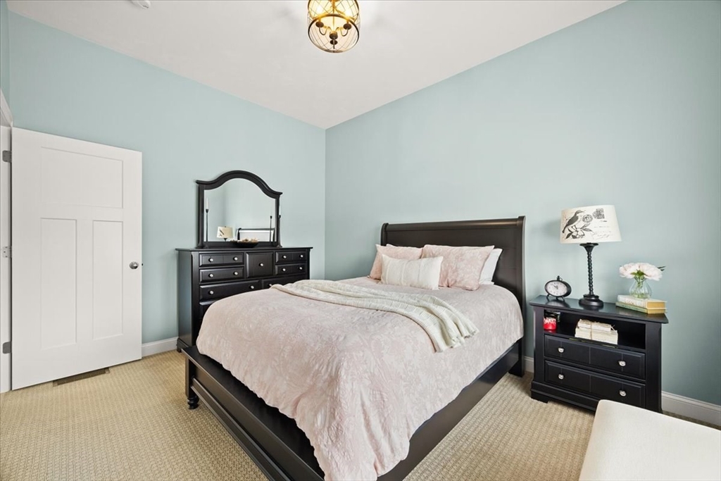 34 Palmer River Road Swansea, MA 02777 - Photo 37 of 42 a bedroom with a bed and a table