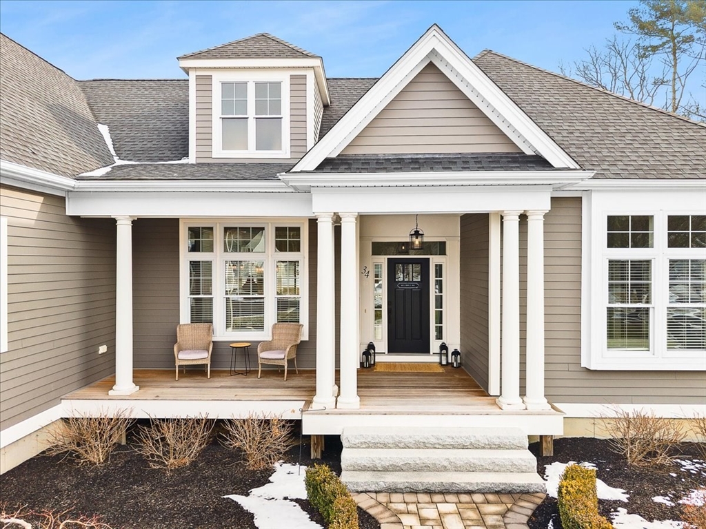 34 Palmer River Road Swansea, MA 02777 - Photo 4 of 42 a front view of a house with a yard