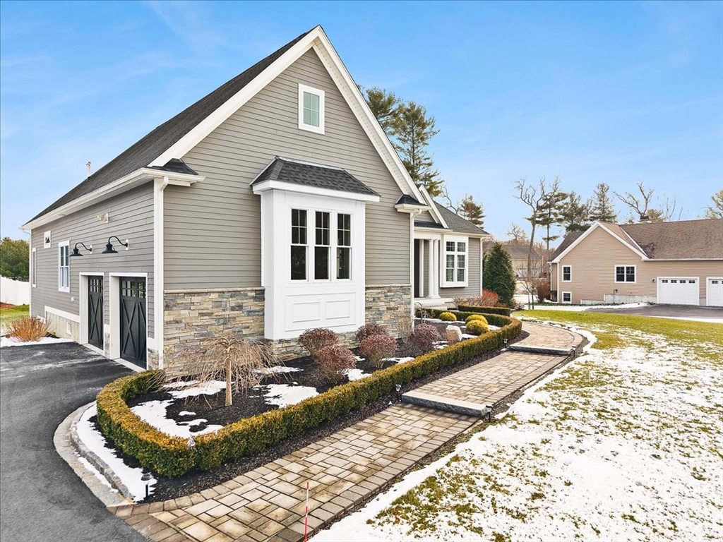 34 Palmer River Road Swansea, MA 02777 - Photo 5 of 42 a front view of a house with a yard