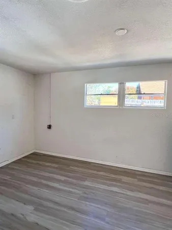 a view of an empty room and window