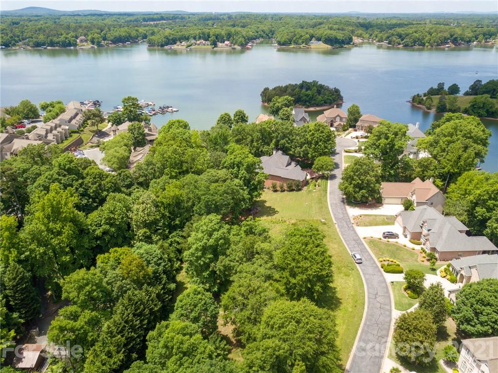 an aerial view of a houses with lake view