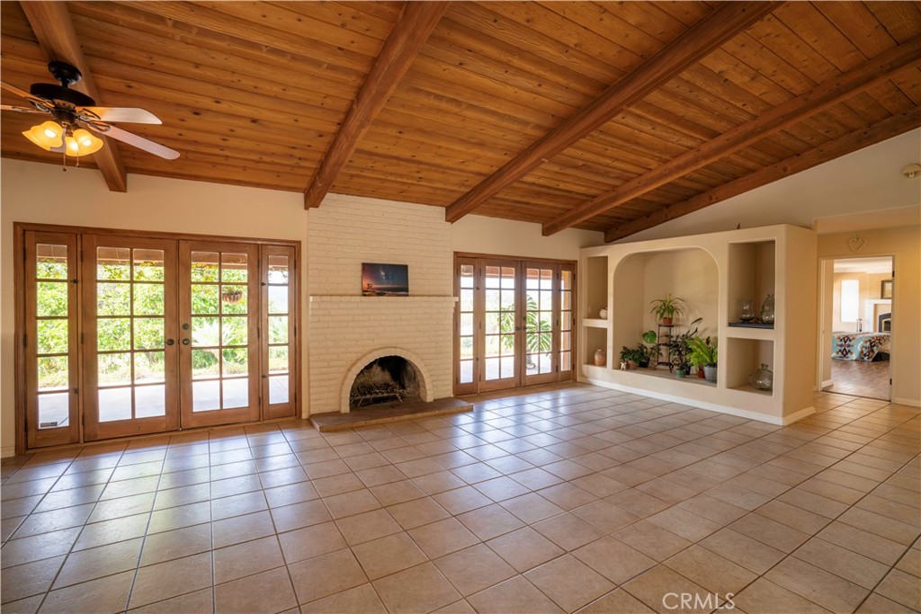 6163 West Lilac Road Bonsall, CA 92003 - Photo 1 of 1 a view of an empty room with a fireplace