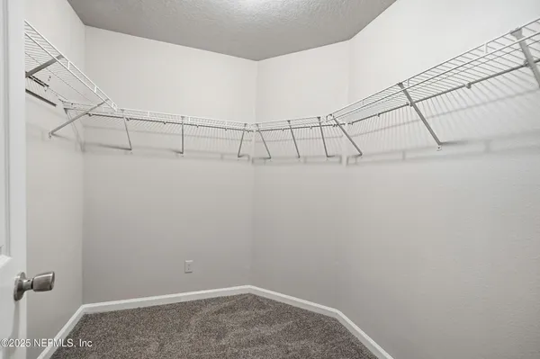 a view of a room with racks on the wall