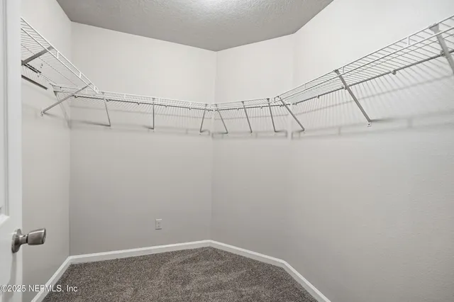 a view of a room with racks on the wall