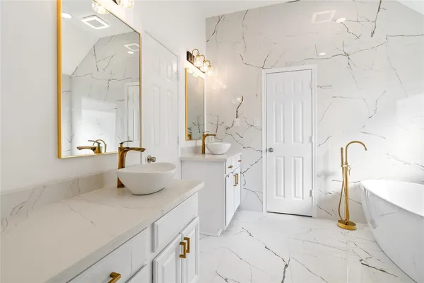 a bathroom with a sink a toilet and a bathtub