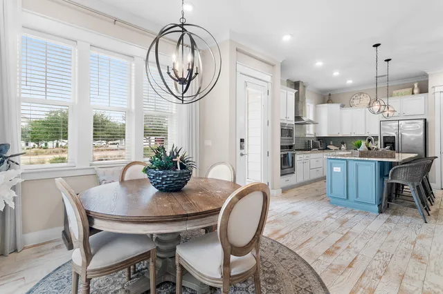 a kitchen with center island center island wooden floor wooden floor and a counter top space