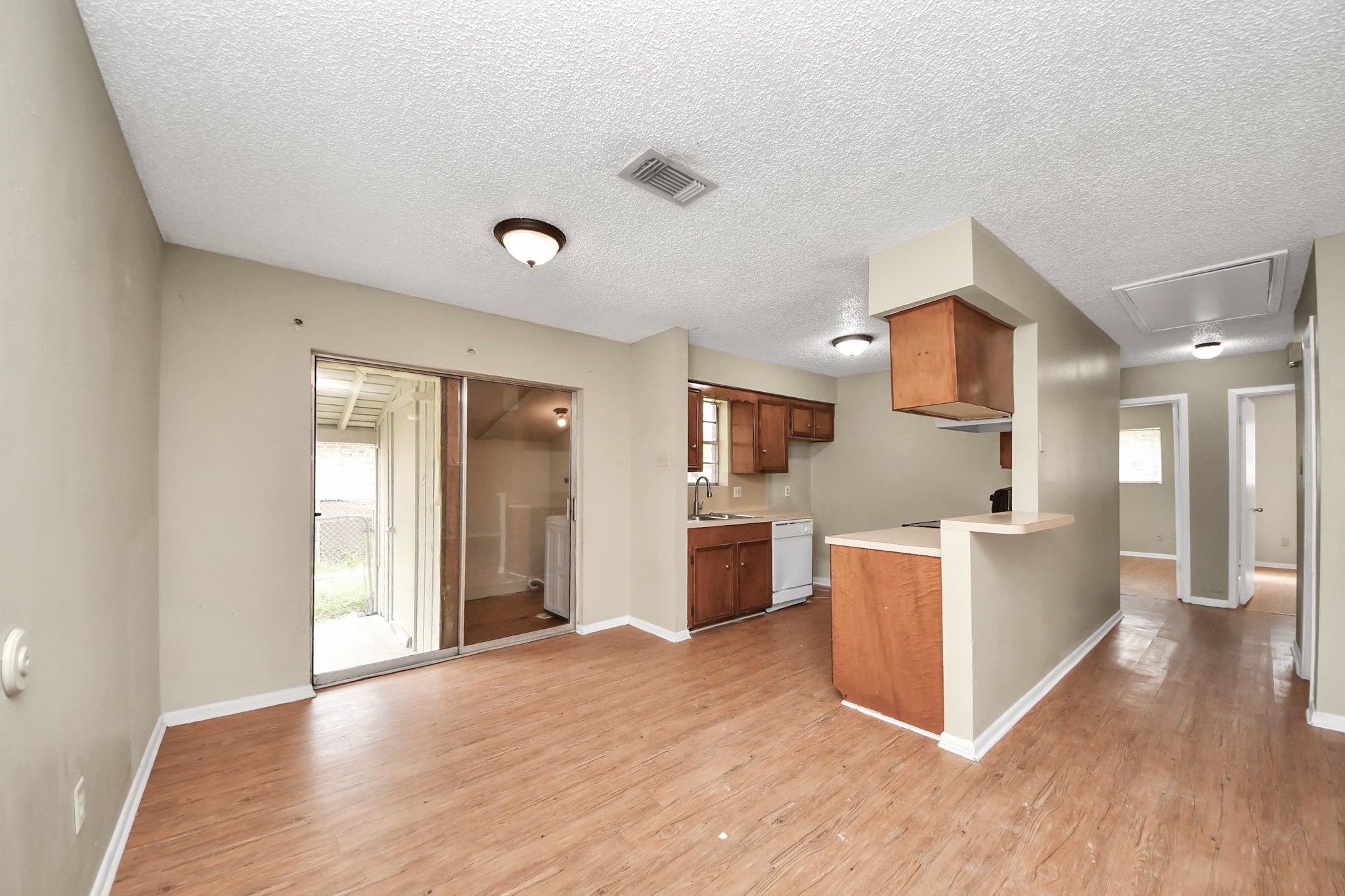 1006 Perry Street, Unit 100 Cleveland, TX 77327 - Photo 15 of 38 a kitchen with a refrigerator and a stove top oven