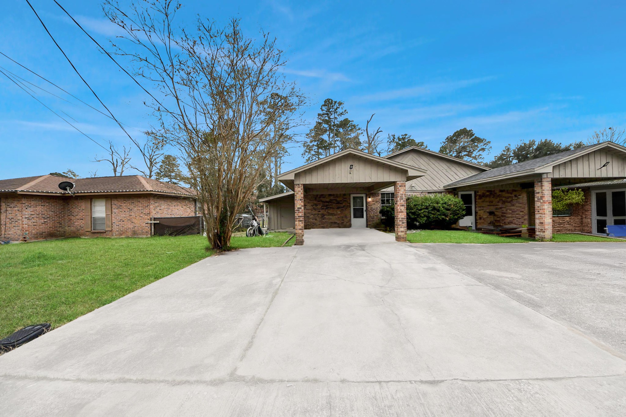 1006 Perry Street, Unit 100 Cleveland, TX 77327 - Photo 2 of 38 a front view of a house with a yard and garage