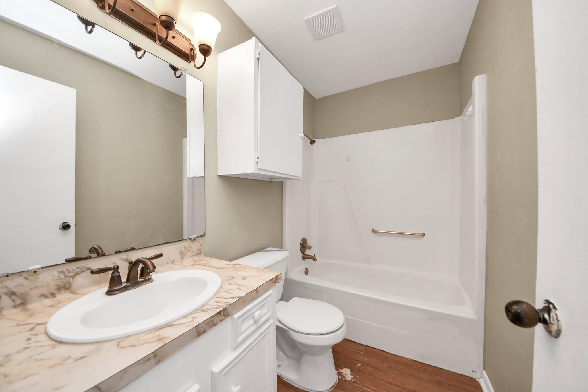 1006 Perry Street, Unit 100 Cleveland, TX 77327 - Photo 27 of 38 a bathroom with a granite countertop sink toilet and shower