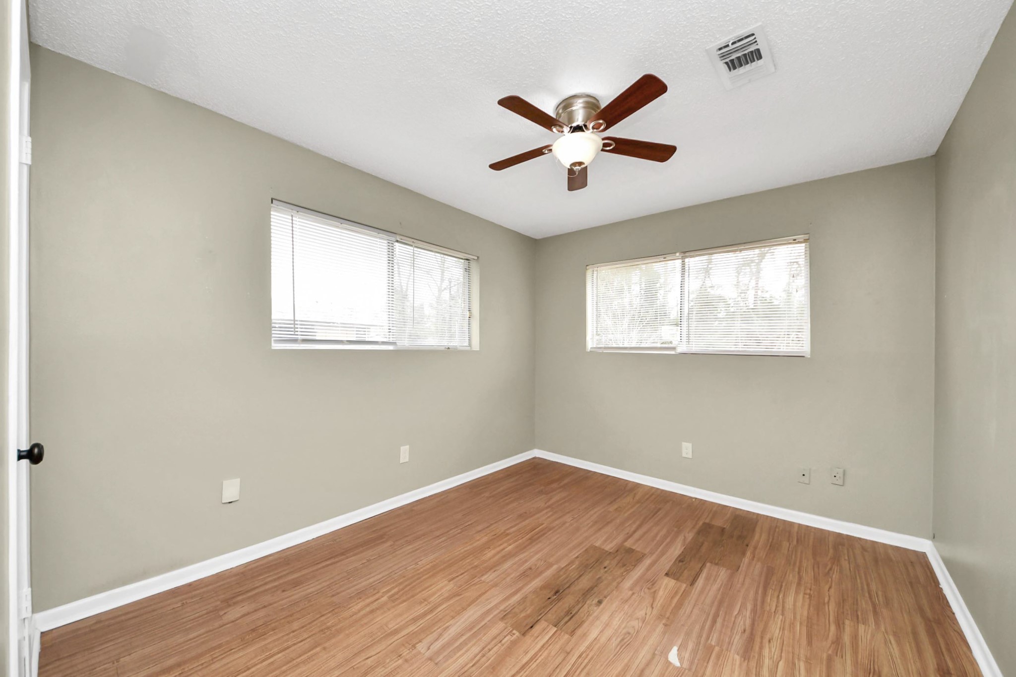 1006 Perry Street, Unit 100 Cleveland, TX 77327 - Photo 29 of 38 a view of empty room with wooden floor and fan