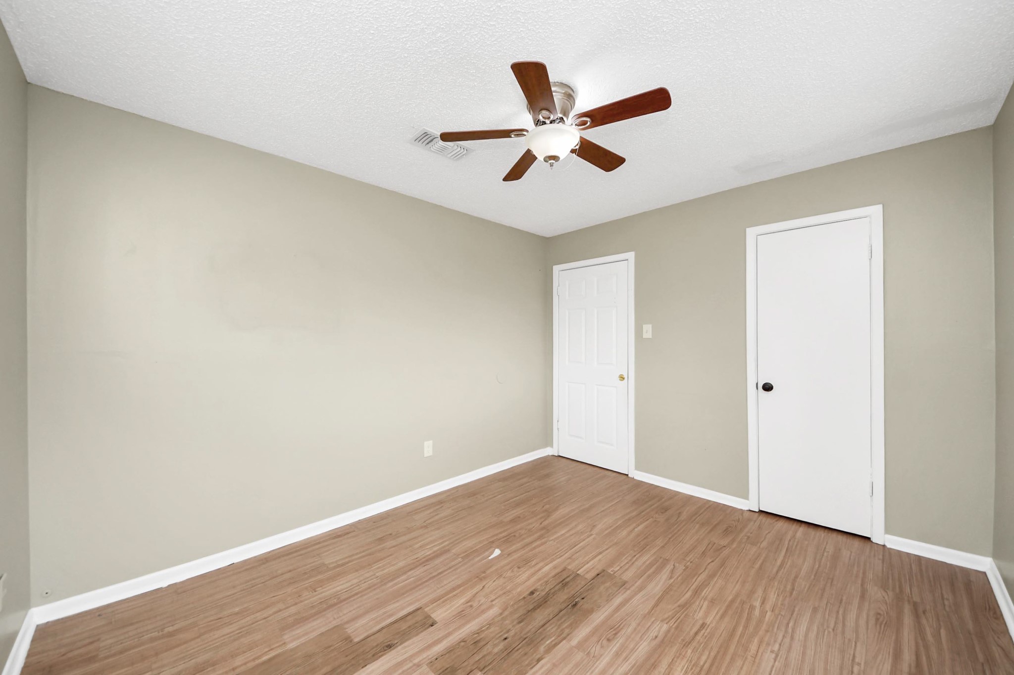 1006 Perry Street, Unit 100 Cleveland, TX 77327 - Photo 31 of 38 a view of a big room with wooden floor and closet area