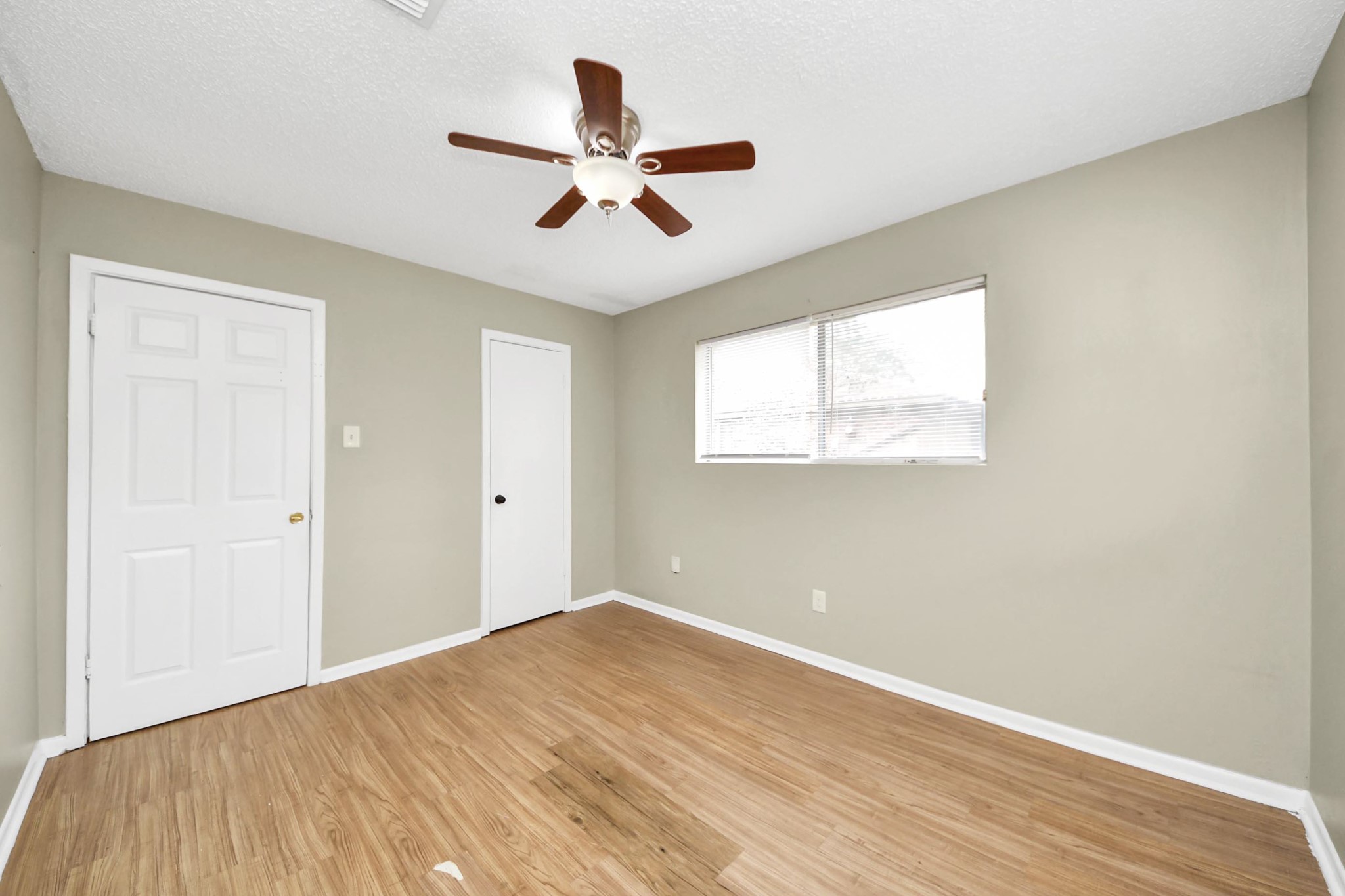 1006 Perry Street, Unit 100 Cleveland, TX 77327 - Photo 32 of 38 a view of a big room with wooden floor and windows in a room