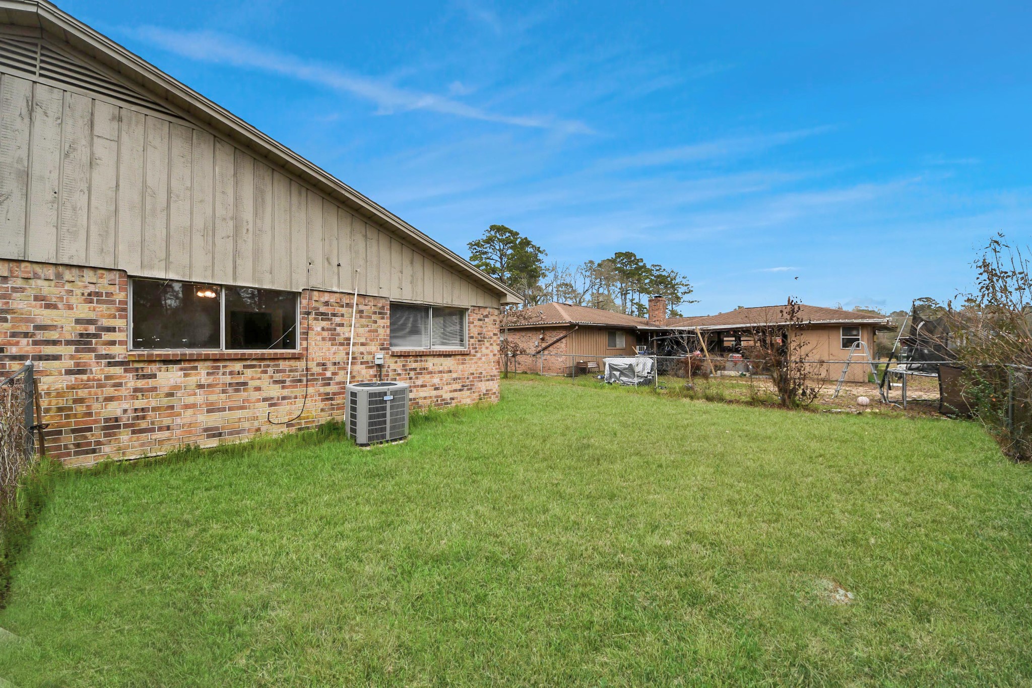 1006 Perry Street, Unit 100 Cleveland, TX 77327 - Photo 38 of 38 a backyard of a house with table and chairs