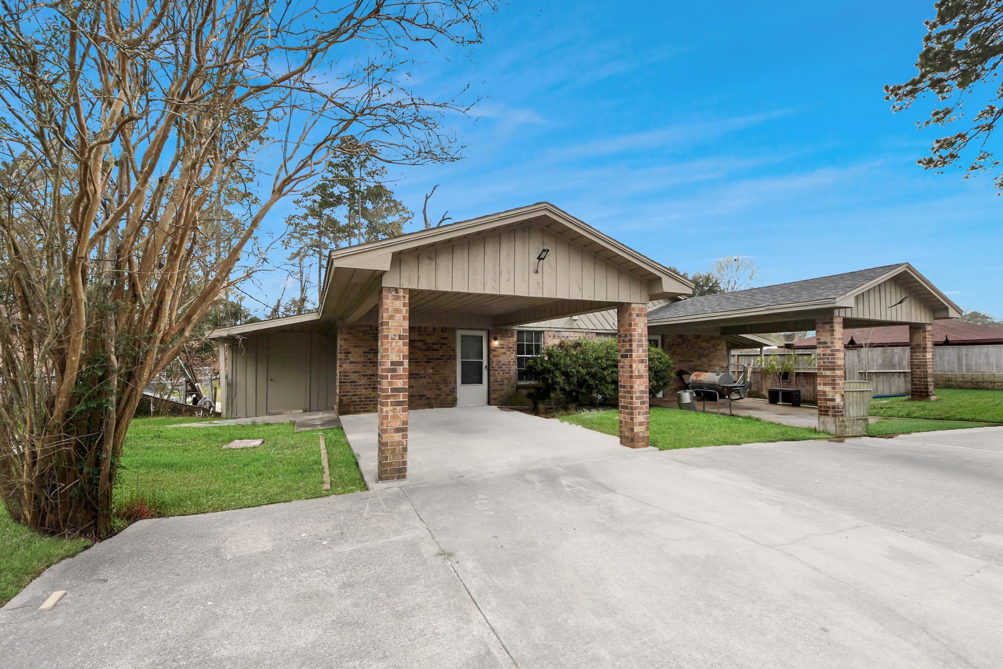 1006 Perry Street, Unit 100 Cleveland, TX 77327 - Photo 4 of 38 a view of a house with a yard and large tree