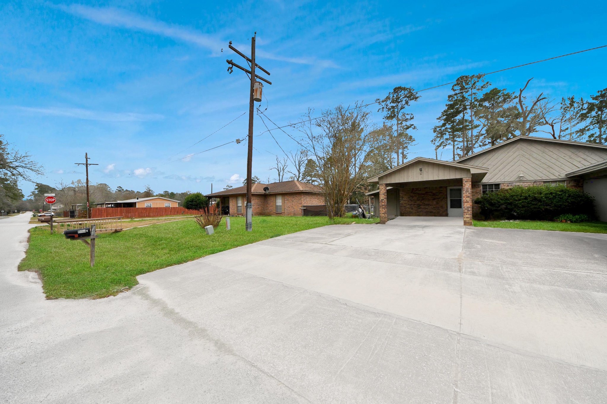 1006 Perry Street, Unit 100 Cleveland, TX 77327 - Photo 6 of 38 a front view of a house with a yard and a garage