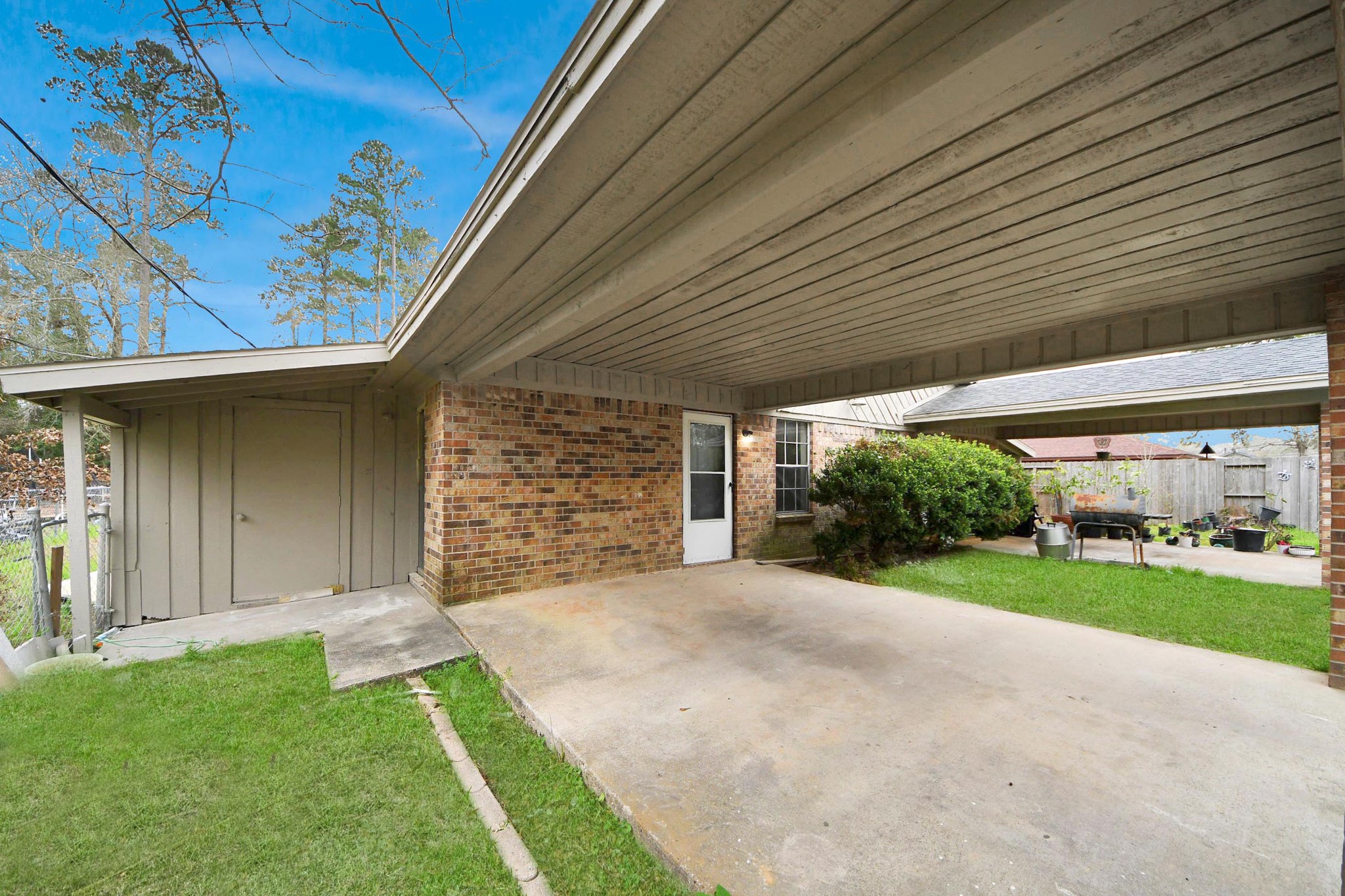 1006 Perry Street, Unit 100 Cleveland, TX 77327 - Photo 7 of 38 a view of a backyard with a garden