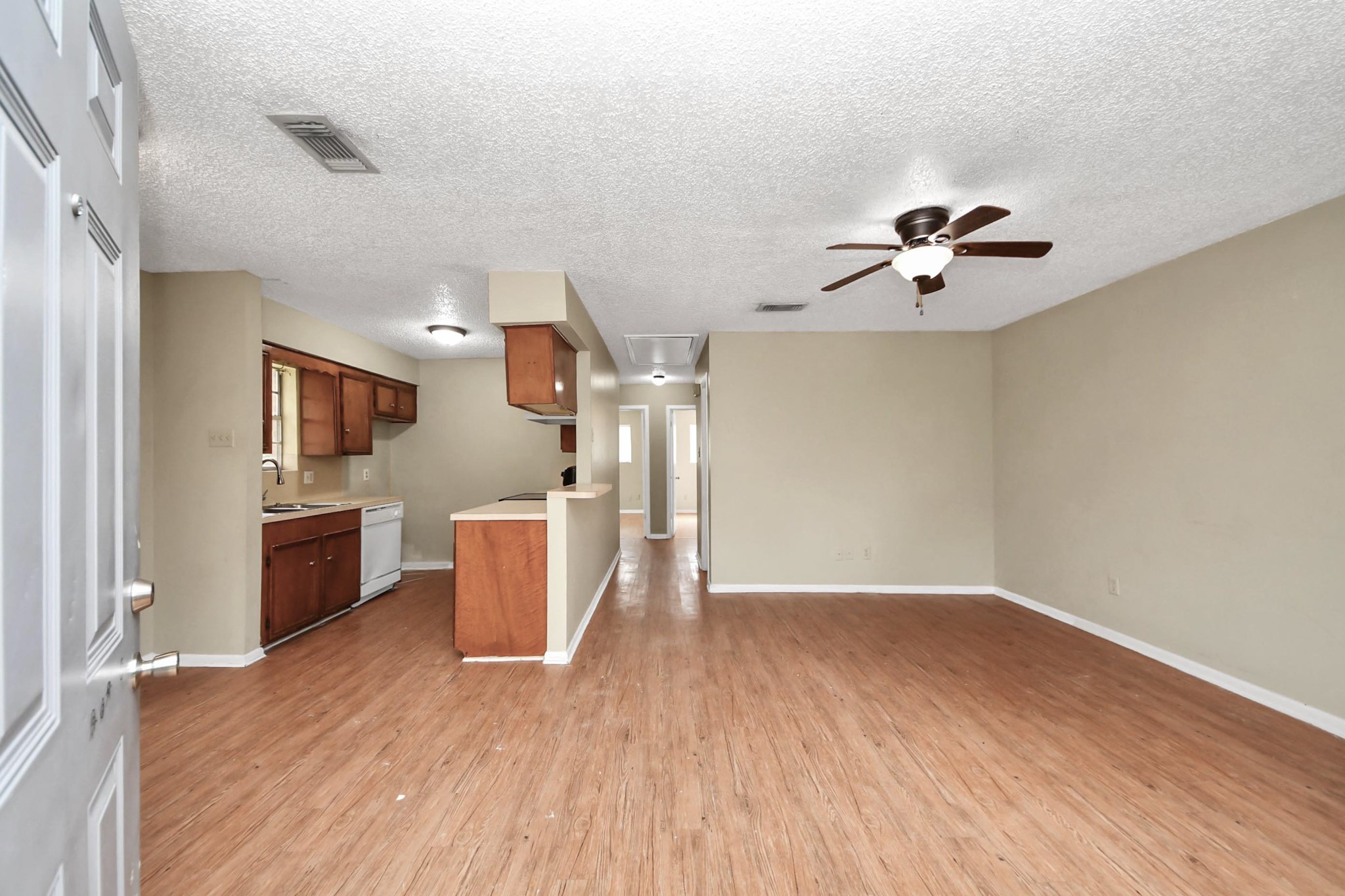 1006 Perry Street, Unit 100 Cleveland, TX 77327 - Photo 8 of 38 wooden floor in an empty room with a window