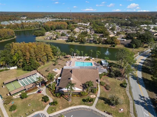 an aerial view of a house with a lake view