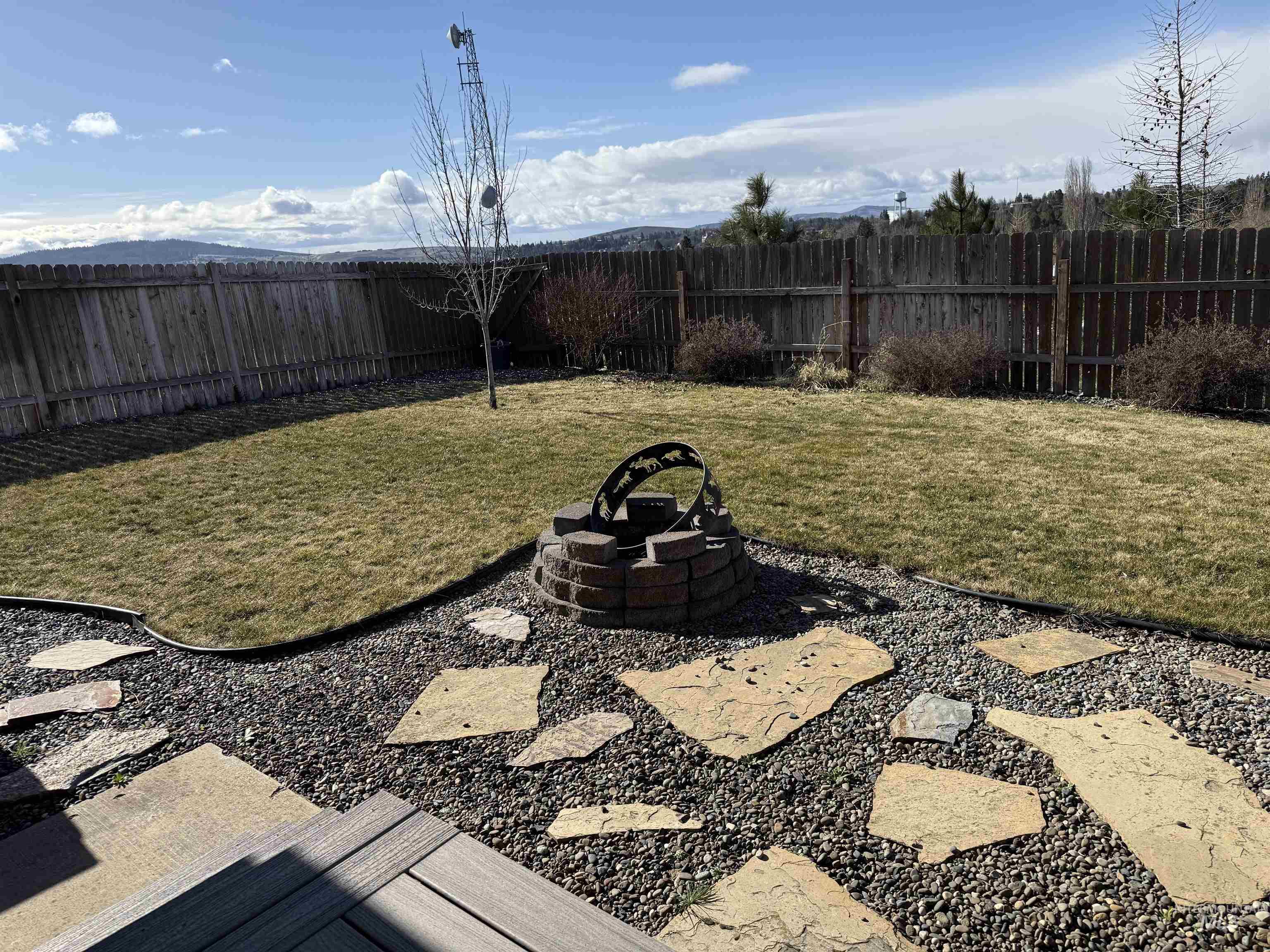 257 Pintail Lane Moscow, ID 83843 - Photo 16 of 28 Fenced backyard featuring a patio and an outdoor fire pit