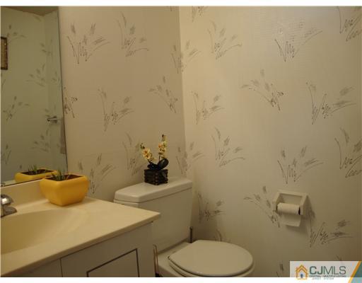 476 Westgate Drive Edison, NJ 08820 - Photo 5 of 10 a bathroom with a sink and a toilet