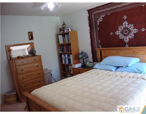 476 Westgate Drive Edison, NJ 08820 - Photo 8 of 10 a bedroom with a bed and closet