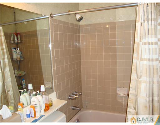 476 Westgate Drive Edison, NJ 08820 - Photo 9 of 10 a bathroom with a shower and a sink