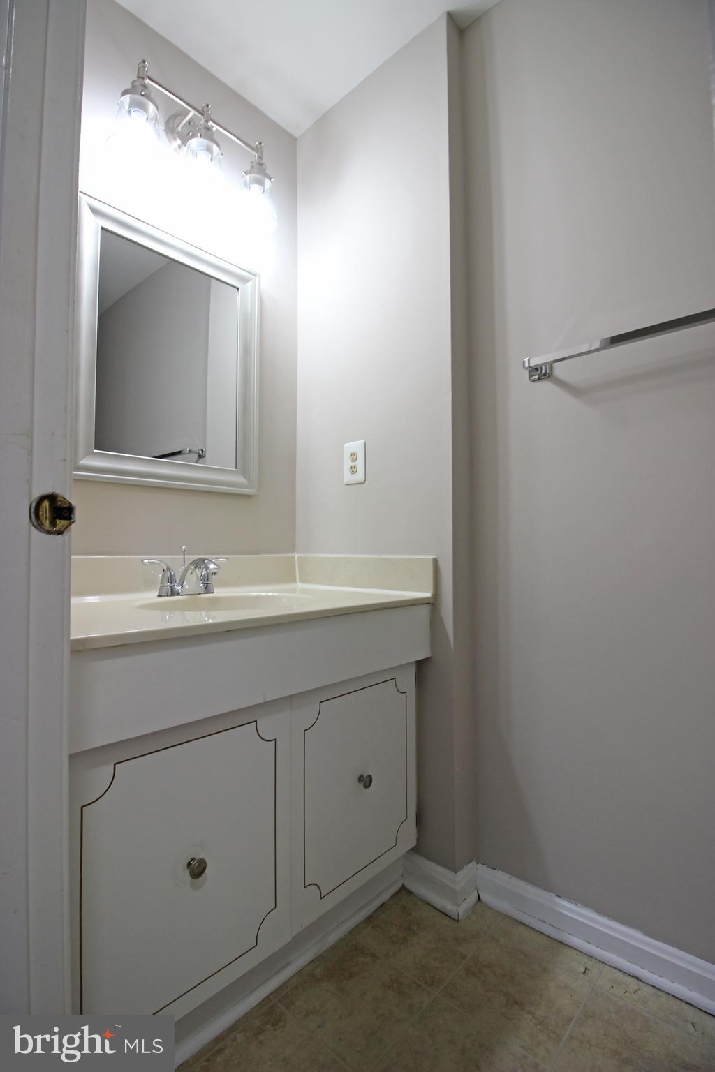 8022 Northumberland Road Springfield, VA 22153 - Photo 35 of 42 a bathroom with a sink and a mirror