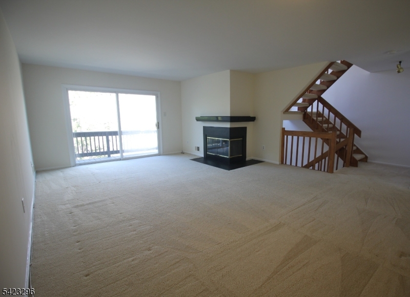 37 Melrose Road Princeton, NJ 08540 - Photo 4 of 37 a view of an empty room with furniture staircase and windows