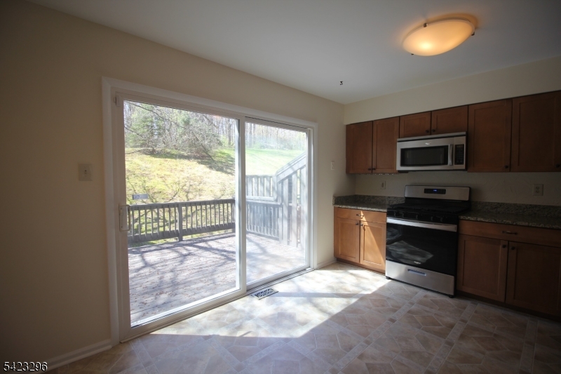37 Melrose Road Princeton, NJ 08540 - Photo 8 of 37 a kitchen with granite countertop a stove a sink and a refrigerator