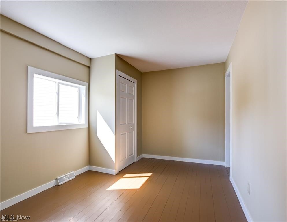 15201 Trask Road Thompson, OH 44086 - Photo 18 of 28 another of the bedrooms - wood flooring - simple but delightful