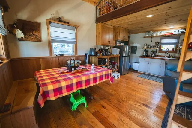 a kitchen with stainless steel appliances granite countertop a refrigerator and a stove