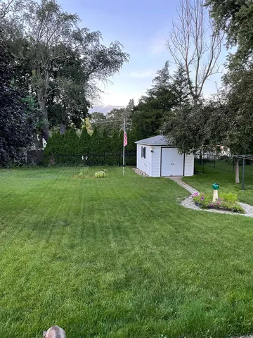 a view of a house with a yard