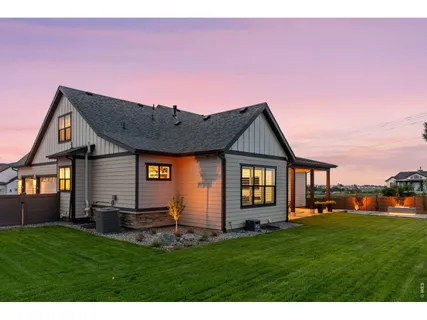 a front view of house with yard and outdoor seating