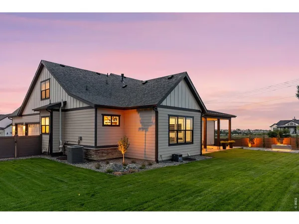 a front view of house with yard and outdoor seating